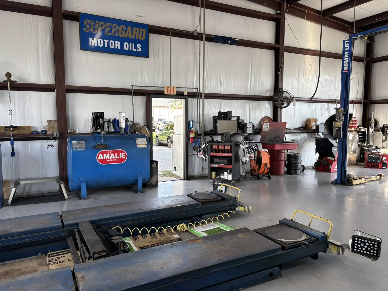 Lift and shop floor at St. George Automotive in Port Charlotte